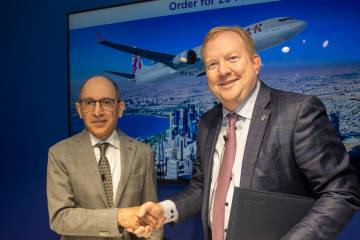 Qatar Airways CEO Akbar Al Baker and Boeing Commercial Airplanes CEO Stan Deal